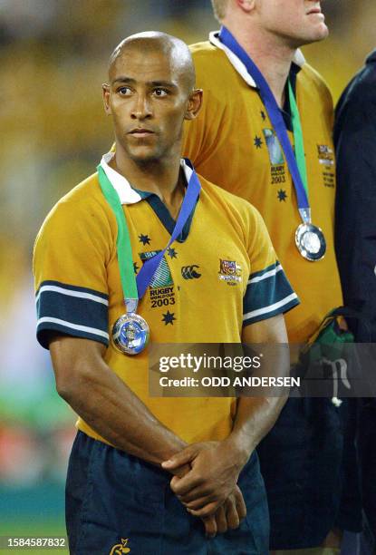 Wallaby captain and scrumhalf George Gregan reacts on the podium of the Rugby World Cup final at the Olympic Park Stadium in Sydney, 22 November...