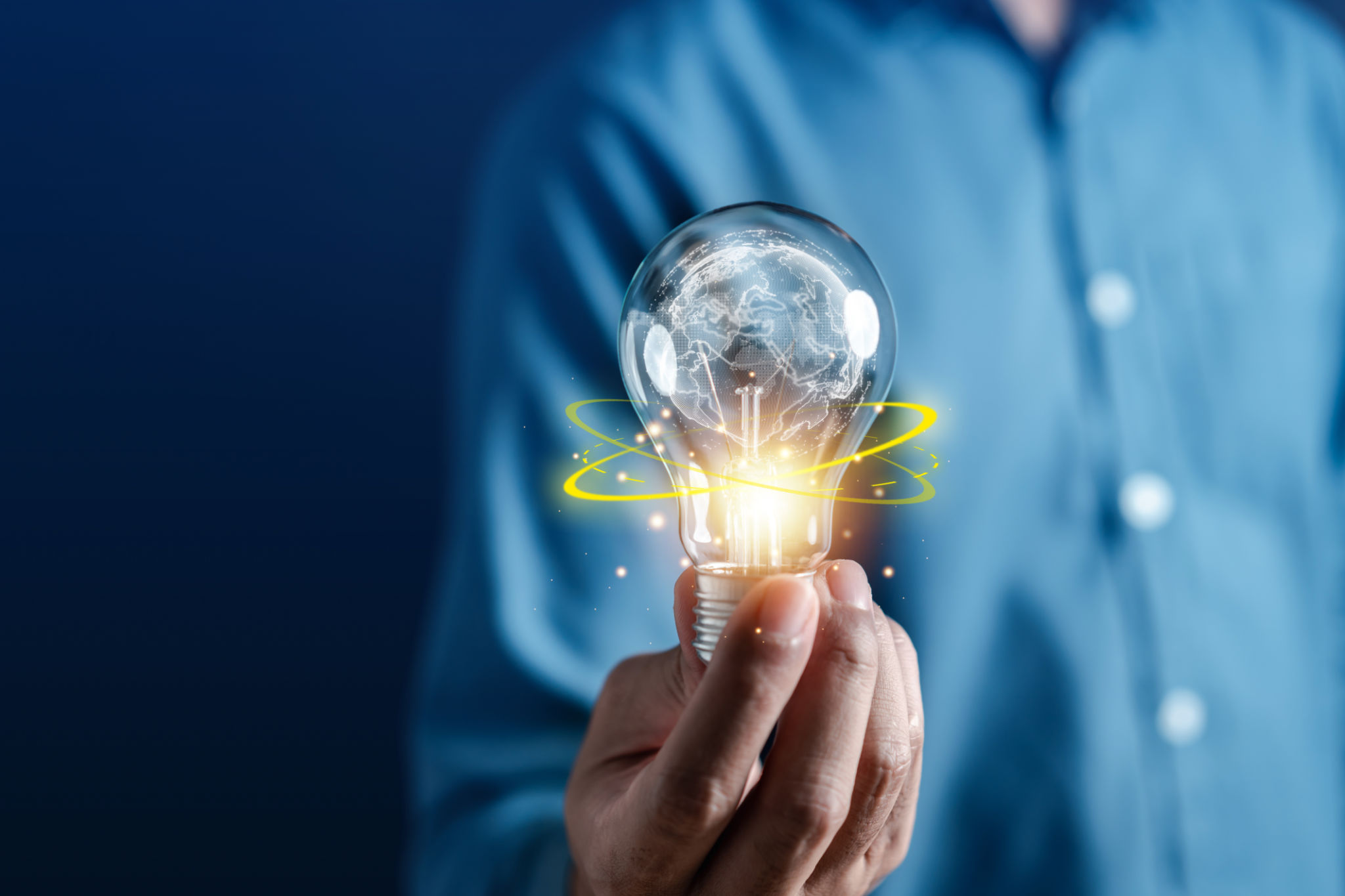 Hand man holding illuminated lightbulb, idea, Global innovation and inspiration with glowing virtual brain, smart intelligent creativity with bulbs, Motivation and innovation concept. Hand man holding illuminated lightbulb, idea, Global innovation and inspiration with glowing virtual brain, smart intelligent creativity with bulbs, Motivation and innovation concept.