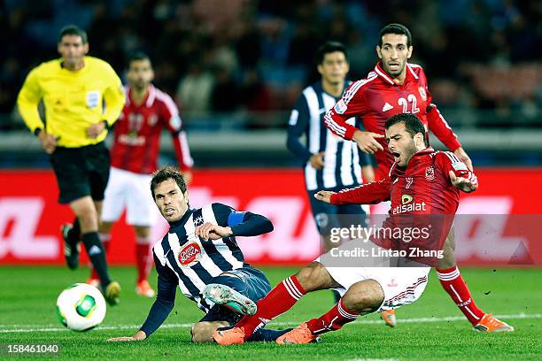Jose Maria Basanta of Monterrey challenges Emad Meteab of Al-Ahly SC during the FIFA Club World Cup 3rd Place Match between Al-Ahly SC and CF...