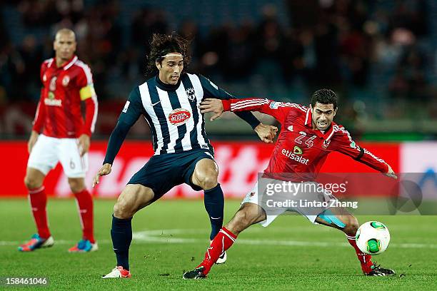 Aldo De Nigris of CF Monterrey challenges Ahmed Fathi during the FIFA Club World Cup 3rd Place Match between Al-Ahly SC and CF Monterrey at...