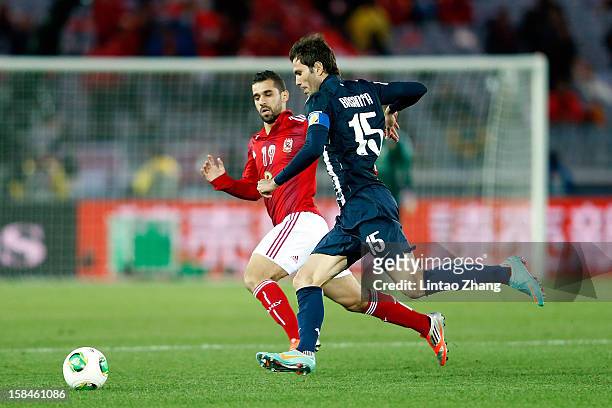 Jose Maria Basanta of Monterrey challenges Abdalla Said of Al-Ahly SC during the FIFA Club World Cup 3rd Place Match between Al-Ahly SC and CF...