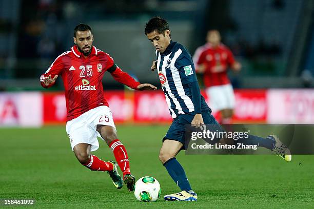 Severo Meza of Monterrey challenges Hossam Ashour of Al-Ahly SC during the FIFA Club World Cup 3rd Place Match between Al-Ahly SC and CF Monterrey at...