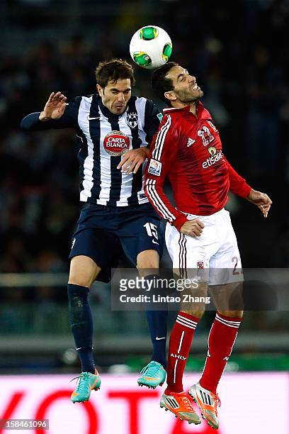 Jose Maria Basanta of Monterrey and Mohamed Aboutrika of Al-Ahly SC jump for a header during the FIFA Club World Cup 3rd Place Match between Al-Ahly...