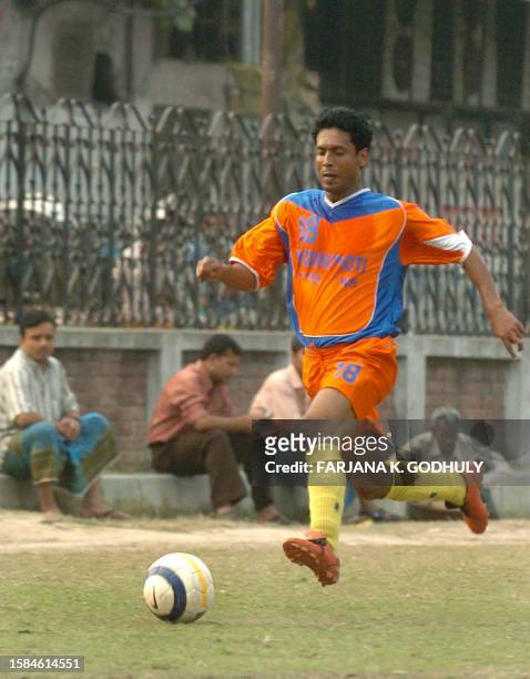 A Bangladeshi footballer from Brothers football club practiseS in preparation for the first professional soccer championship at their club grounds in...
