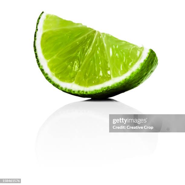 lime wedge - lime stock pictures, royalty-free photos & images