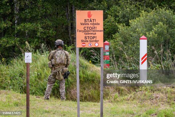 Member of the State Border Guard patrols at the Latvia/Russia border near Lidumnieki, Eastern Latvia on August 8 during a vist by the President of...