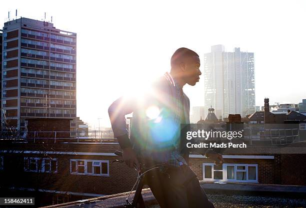 urban shoot, east london - man on top of building stock pictures, royalty-free photos & images