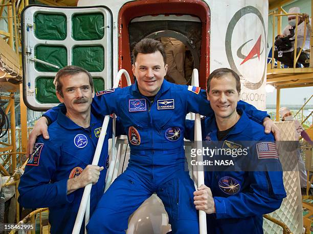 In this handout image provided by NASA, Expedition 34/35 Flight Engineer Chris Hadfield of the Canadian Space Agency, Soyuz Commander Roman Romanenko...