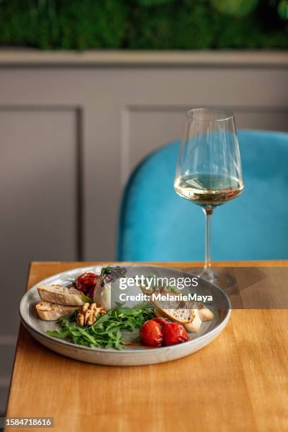 appetizer plate in restaurant with burrata, tomatoes and garlic bread mozzarella caprese antipasti - burrata stock pictures, royalty-free photos & images