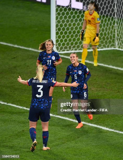 Jill Roord celebrates with Stefanie Van Der Gragt and Lieke Martens of Netherlands after scoring her team's seventh goal during the FIFA Women's...