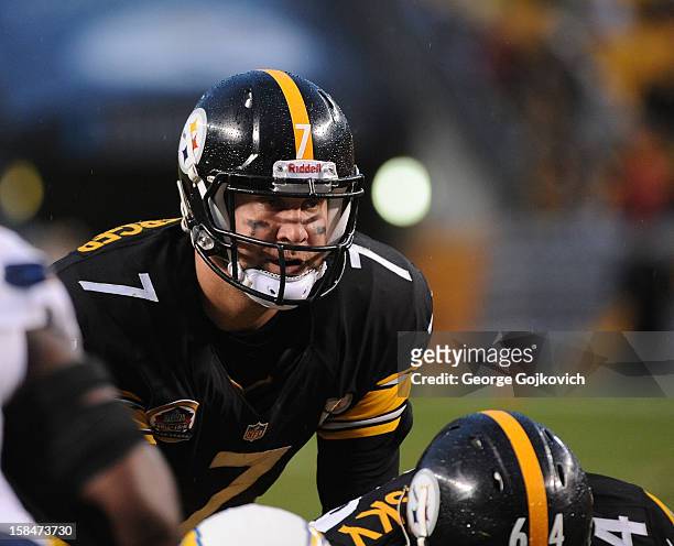 Quarterback Ben Roethlisberger of the Pittsburgh Steelers looks on from the line of scrimmage as he stands behind center Doug Legursky during a game...