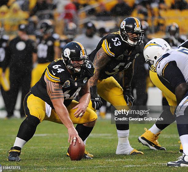 Center Doug Legursky and guard Maurkice Pouncey of the Pittsburgh Steelers look on from the line of scrimmage as rain falls during a game against the...