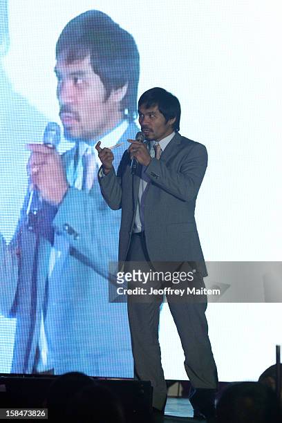 World boxing icon Manny Pacquiao speaks to supporters, family, friends and visitors, during his 34th birthday party on December 17, 2012 in General...