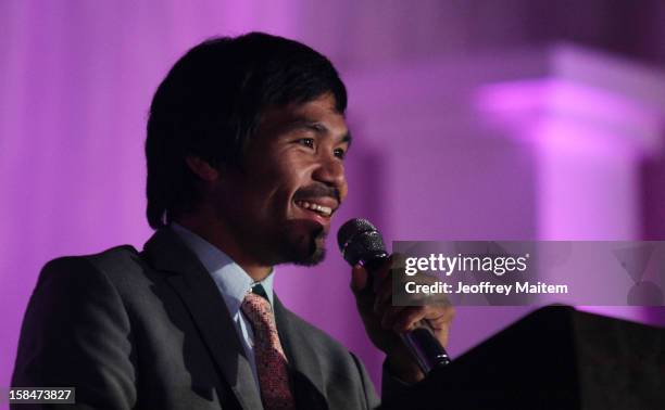 World boxing icon Manny Pacquiao speaks to supporters, family, friends and visitors, during his 34th birthday party on December 17, 2012 in General...