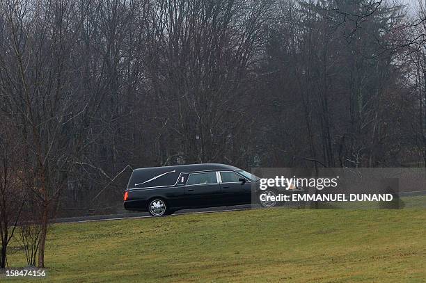 Hearse carrying the body of Jack Pinto one of the victims of the Sandy Hook elementary school shooting, arrives at Newtown Village Cemetary, on...