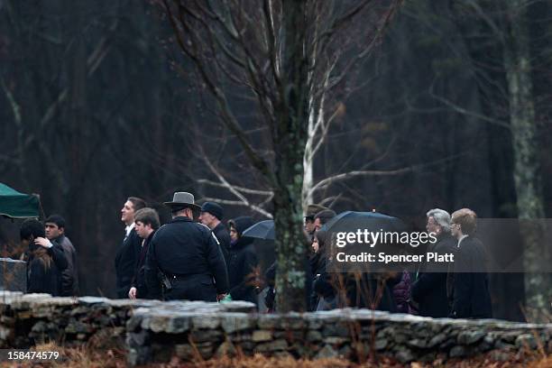 People attend the funeral services for six year-old Noah Pozner, who was killed in the shooting massacre in Newtown, CT, at B'nai Israel Cemetery on...