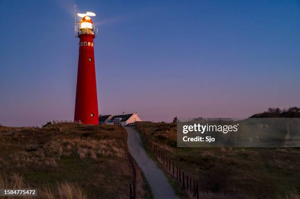 lighthouse at schiermonnikoog island in the dunes during sunset - schiermonnikoog stock pictures, royalty-free photos & images