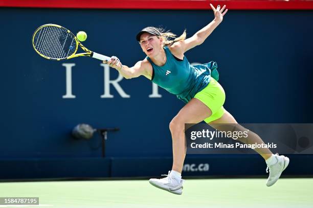 Caroline Wozniacki of Denmark stretches out the racket against Kimberly Birrell of Australia on Day 2 during the National Bank Open at Stade IGA on...