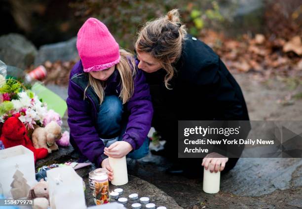 Newtown community comes together to mourn the loss of 27 people including 20 children in the Sandy Hook Elementary School shooting.