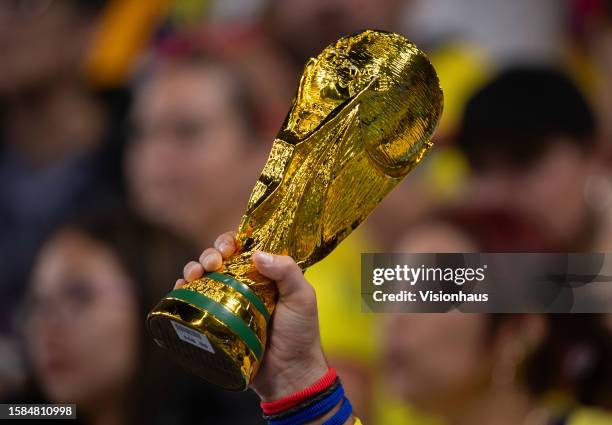 Replica of the FIFA World Cup trophy in the hand of a fan during the FIFA Women's World Cup Australia & New Zealand 2023 Group H match between...