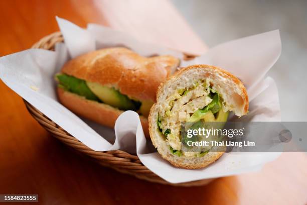 banh mi sandwich, traditional vietnamese street food. - papel de cera imagens e fotografias de stock