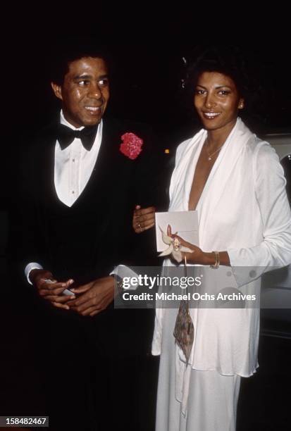 Comedian and actor Richard Pryor and actress Pam Grier attend the 19th Annual Grammy Awards at The Hollywood Palladium in Los Angeles, California.