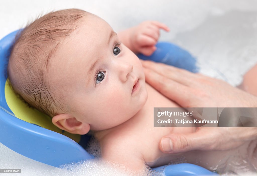 Baby being washed