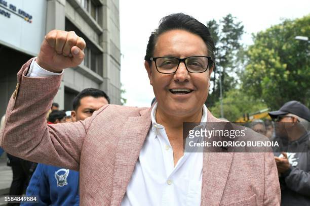 Former Assembly member and now presidential candidate, Fernando Villavicencio, gestures outside the Attorney General's Office in Quito on August 8,...
