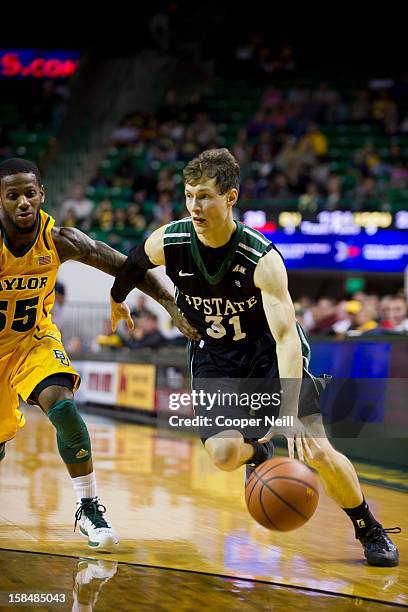 Mario Blessing of the USC Upstate Spartans drives to the basket against the Baylor University Bears on December 17, 2012 at the Ferrell Center in...