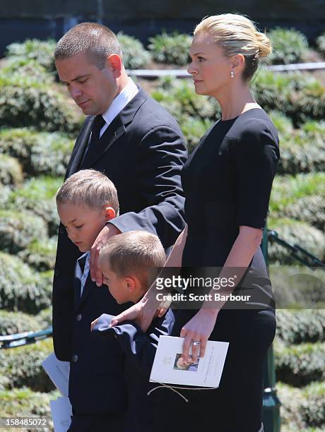 Lachlan Murdoch and Sarah Murdoch walk with their children Kalan and Aidan as they leave after attending the Dame Elisabeth Murdoch public memorial...