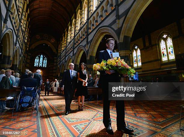 Victorian Premier Ted Baillieu walks ahead of Rupert Murdoch and Wendi Deng at a memorial service for Dame Elisabeth Murdoch at St. Pauls Cathederal...