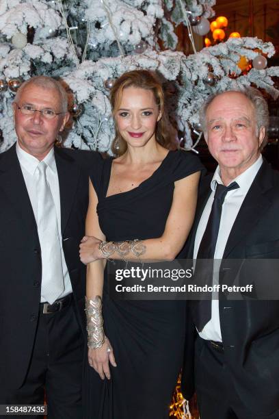 Helene de Fougerolles poses with Joel Fleury and Daniel Colas at restaurant Le Grand Colbert on December 17, 2012 in Paris, France.