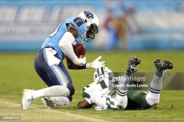 Cornerback Jason McCourty of the Tennessee Titans intercepts a ball intended for Wide receiver Jeremy Kerley of the New York Jets in the third...