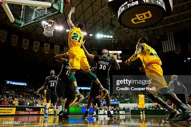 Isaiah Austin of the Baylor University Bears shoots the ball against the USC Upstate Spartans on December 17, 2012 at the Ferrell Center in Waco,...