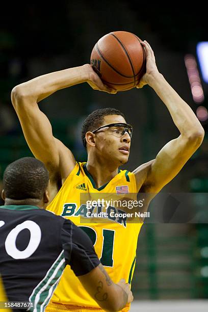 Isaiah Austin of the Baylor University Bears brings the ball up the court against the USC Upstate Spartans on December 17, 2012 at the Ferrell Center...