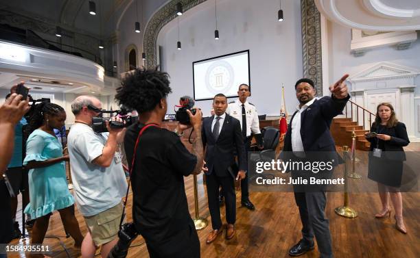 Montgomery Mayor Steven Reed, Center-L), and Police Chief Darryl J. Albert leave a press conference after giving an update regarding the brawl that...