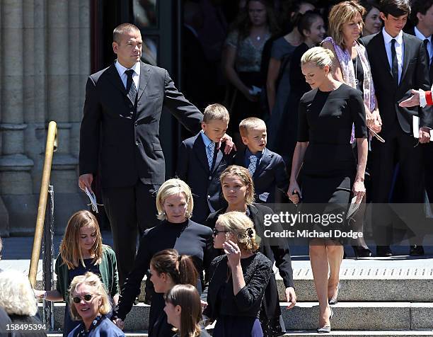 Lachlan Murdoch and Sarah Murdoch walk with their children Kalan and Aidan as they leave after attending the Dame Elisabeth Murdoch public memorial...