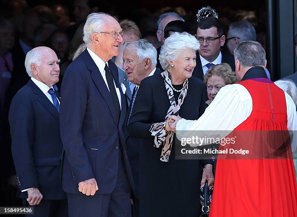 Former Prime Ministers John Howard and Malcom Fraser with his wife Tamara Fraser leave after attending the Dame Elisabeth Murdoch public memorial at...