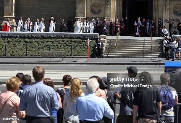 People at Federation Square watch the Dame Elisabeth Murdoch public memorial at St Paul's Cathedral on December 18, 2012 in Melbourne, Australia....