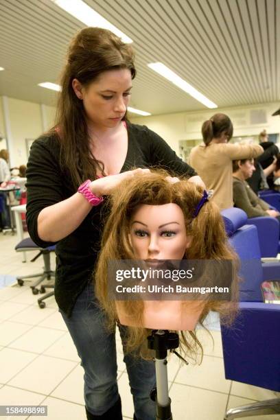 Apprenticeship as hairdresser machines mechanic in the Butzweilerhof education center of chamber of commerce Cologne on December 10, 2012 in Cologne,...