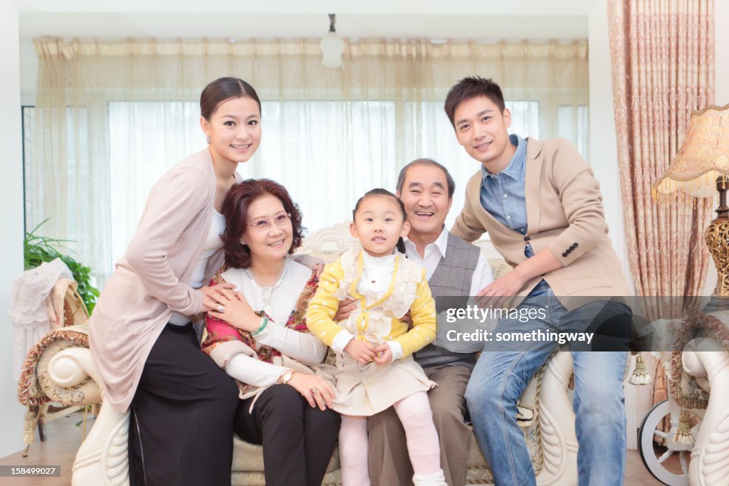 Extended family in living room smiling