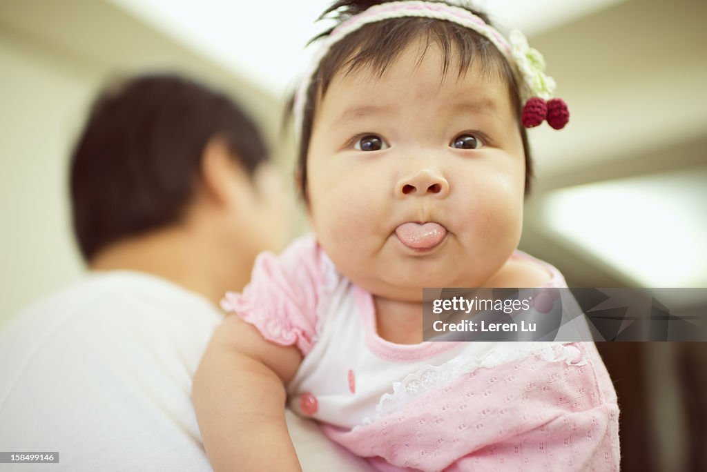Baby on father's shoulder