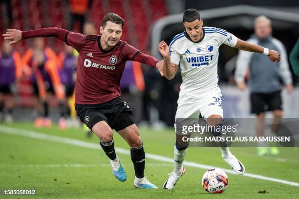Sparta Prague's Finnish midfielder Kaan Kairinen fights for the ball with FC Copenhagen's Tunisian forward Elias Achouri during the UEFA Champions...