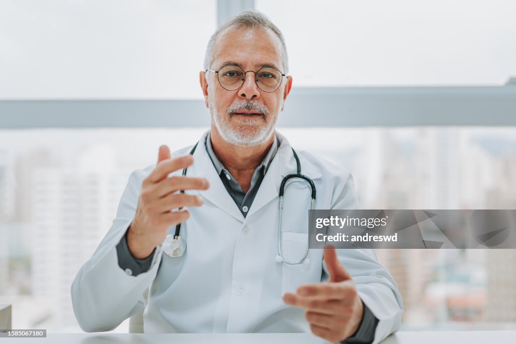 Portrait of a doctor assisting patient online