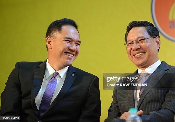 Indonesian Minister of Trade Gita Irawan Wirjawan talks with Minister of Industry and Commerce of the Lao PDR Nam Viyaketh during the inauguration of...