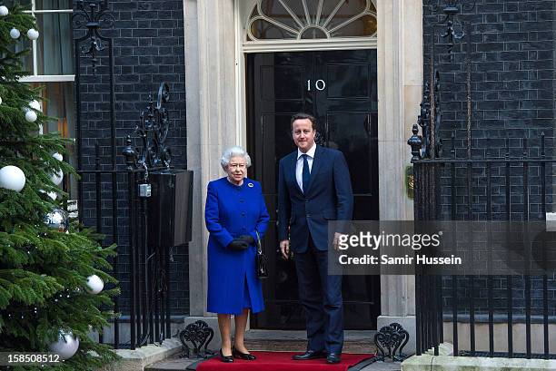 Queen Elizabeth II is greeted by Prime Minister David Cameron as she arrives at Number 10 Downing Street to attend the Government's weekly Cabinet...
