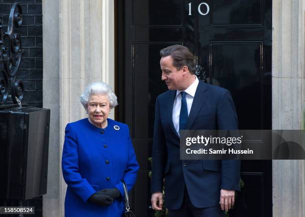 Queen Elizabeth II is greeted by Prime Minister David Cameron as she arrives at Number 10 Downing Street to attend the Government's weekly Cabinet...