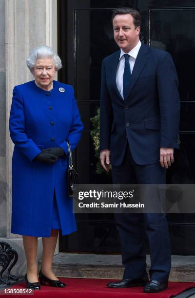 Queen Elizabeth II is greeted by Prime Minister David Cameron as she arrives at Number 10 Downing Street to attend the Government's weekly Cabinet...