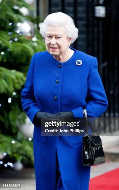 Queen Elizabeth II leaves Number 10 Downing Street after attending the Government's weekly Cabinet meeting on December 18, 2012 in London