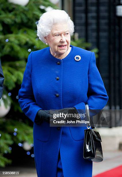 Queen Elizabeth II leaves Number 10 Downing Street after attending the Government's weekly Cabinet meeting on December 18, 2012 in London